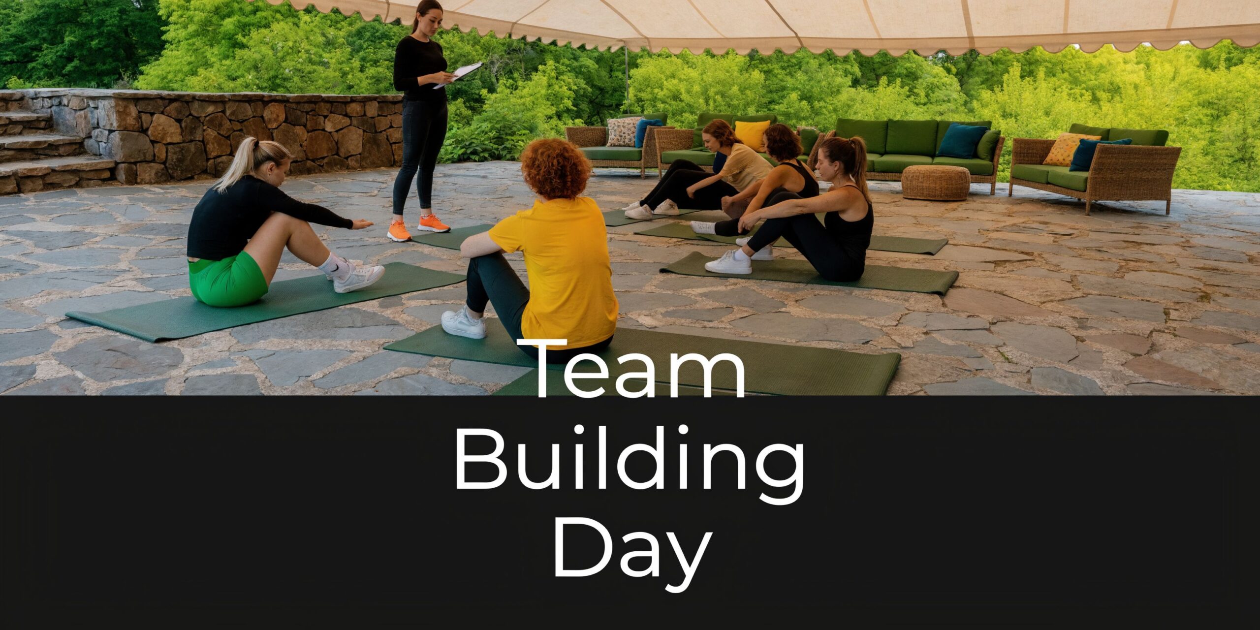 A group of women participating in an outdoor yoga session for a corporate team building day activity.