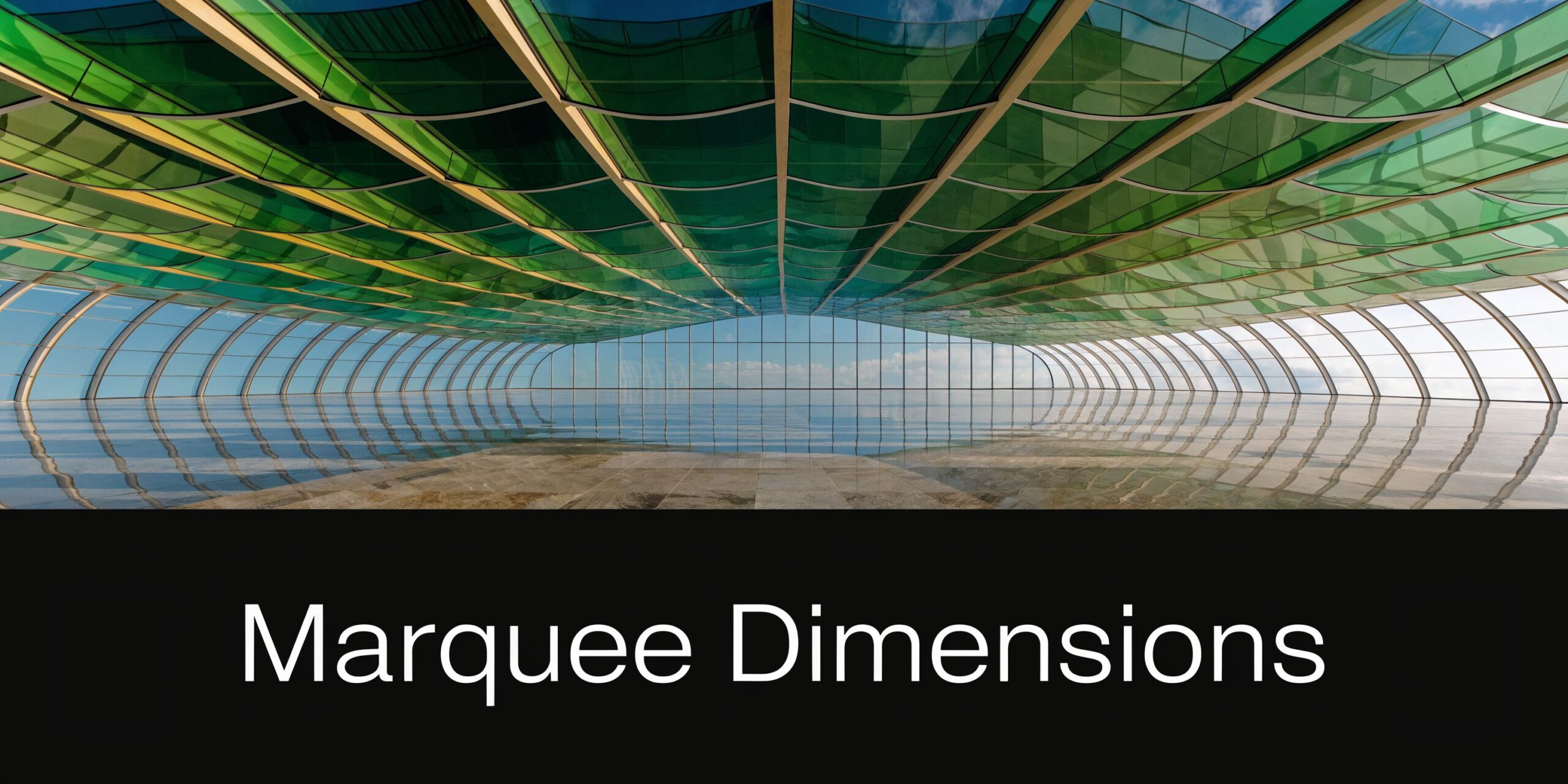 A wide angle interior view of a spacious modern architectural structure with a translucent green glass roof.