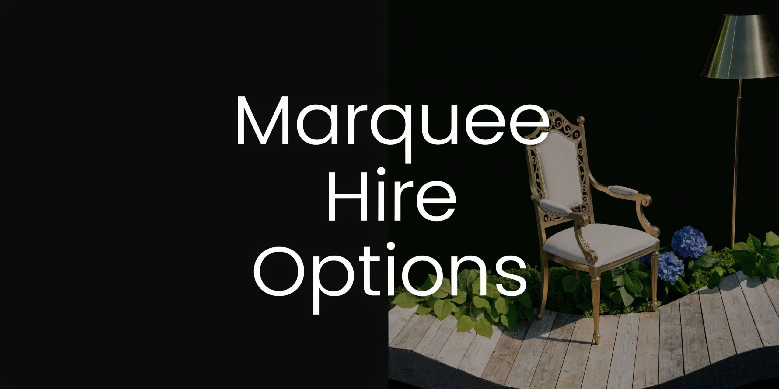 An elegant vintage chair placed on a wooden deck next to a lamp and blue flowers.