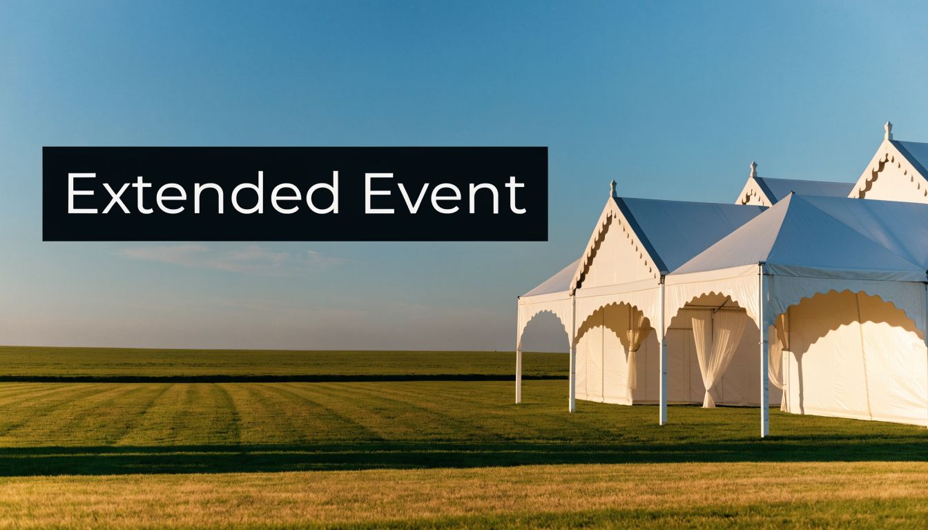 Large white event marquee tent set up on a grassy field under a clear blue sky