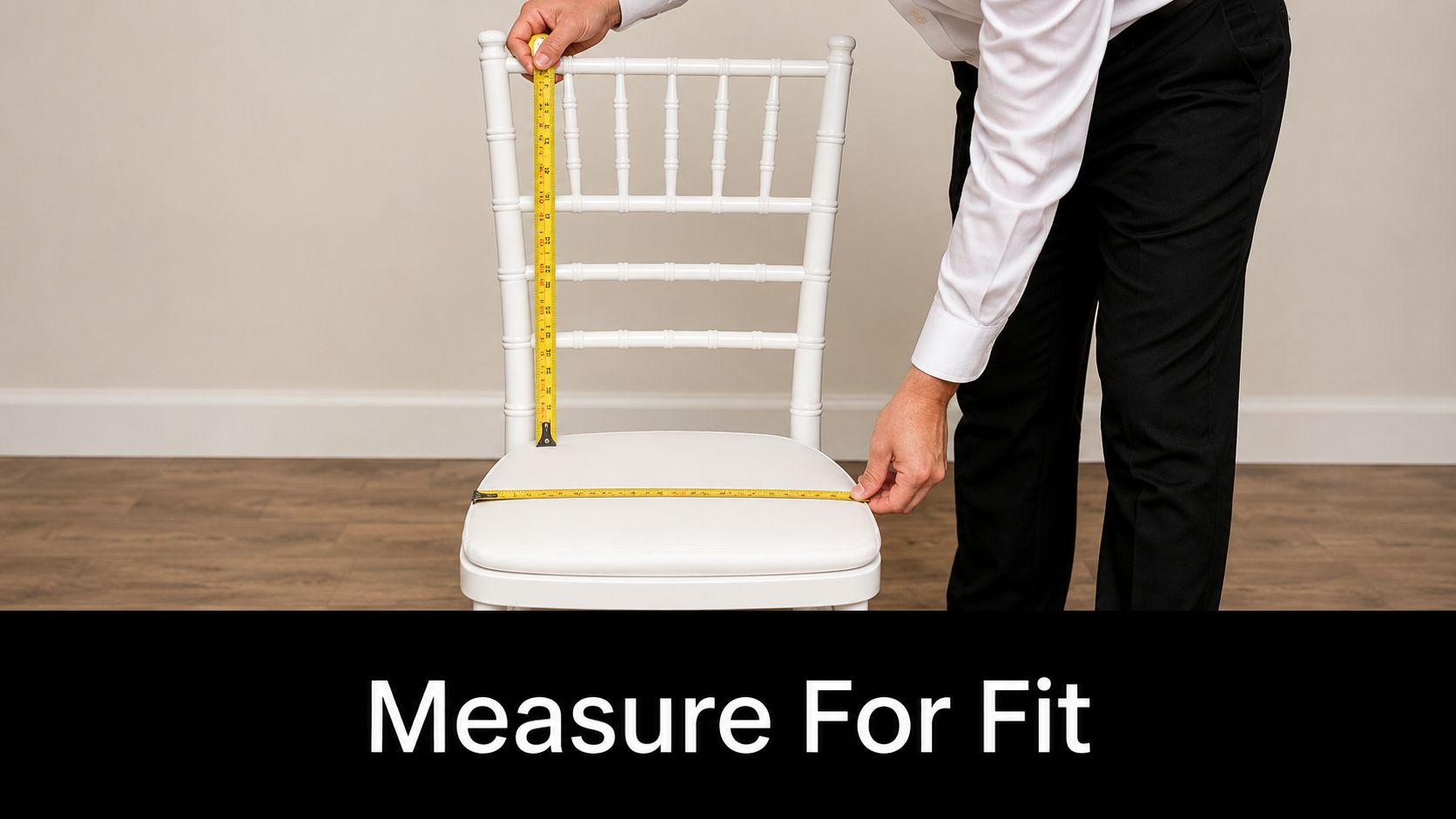 A person measuring a white wedding chair with a yellow measuring tape for a perfect cover fit.
